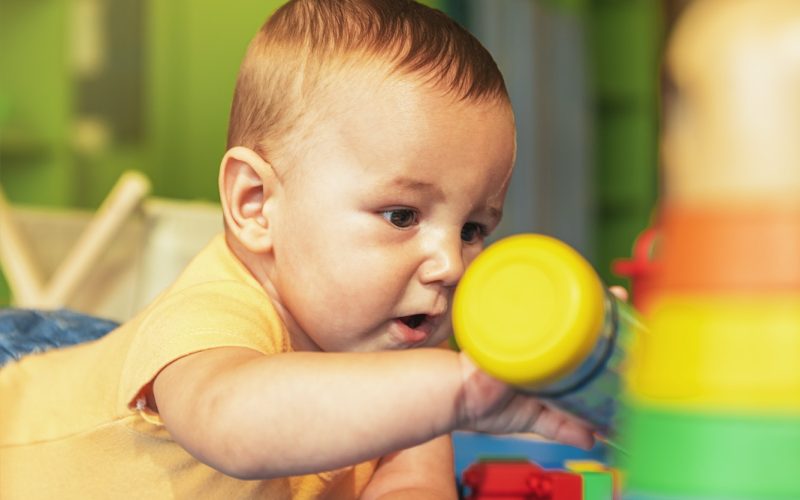 happy-baby-playing-with-toy-blocks-in-the-kindergarten-.jpg